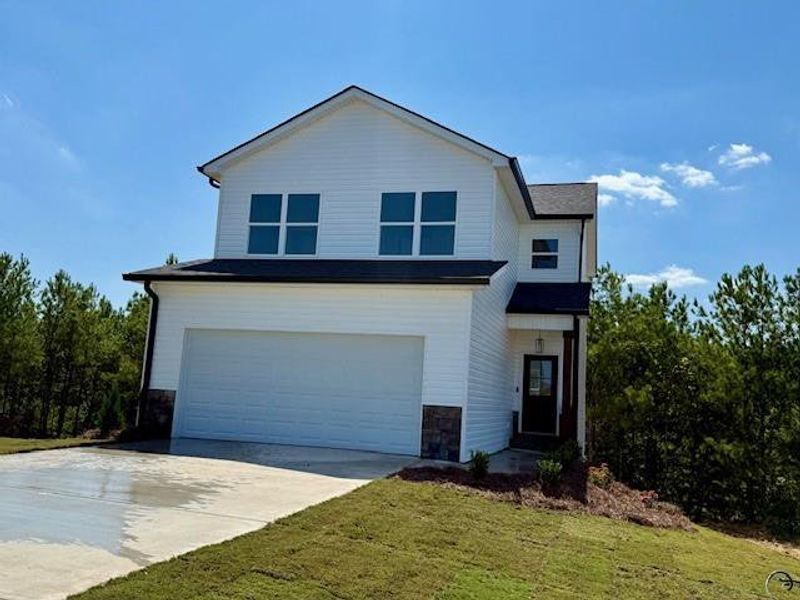 Front exterior of a new home in , Calhoun, GA, highlighting curb appeal (Image 1).