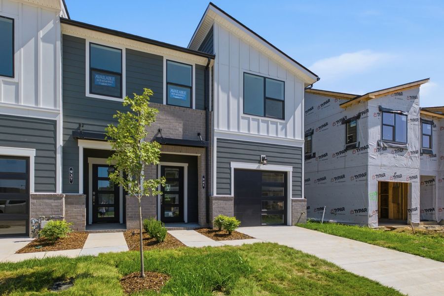 Front exterior of a new home in Nexus Townhomes, Gallatin, TN, highlighting curb appeal (Image 23). Front exterior of a new home in Nexus Townhomes, Gallatin, TN, highlighting curb appeal (Image 23).