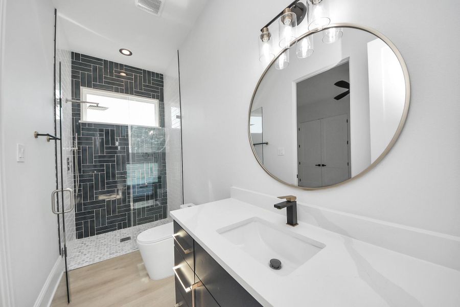 Secondary bath with luxurious walk-in shower. Secondary bath with luxurious walk-in shower.