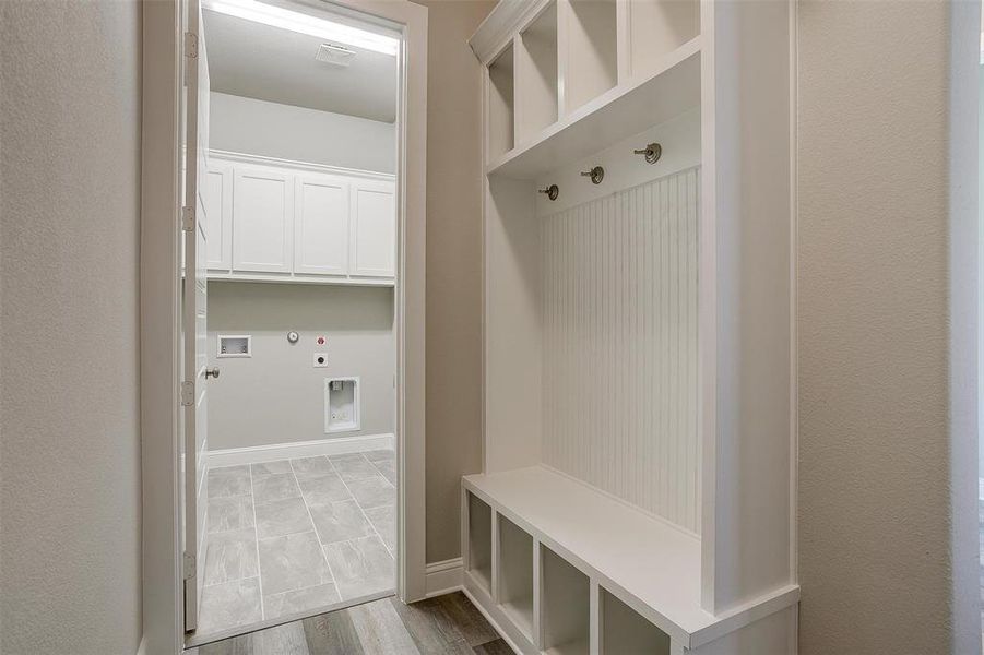 Mudroom with light wood-type flooring