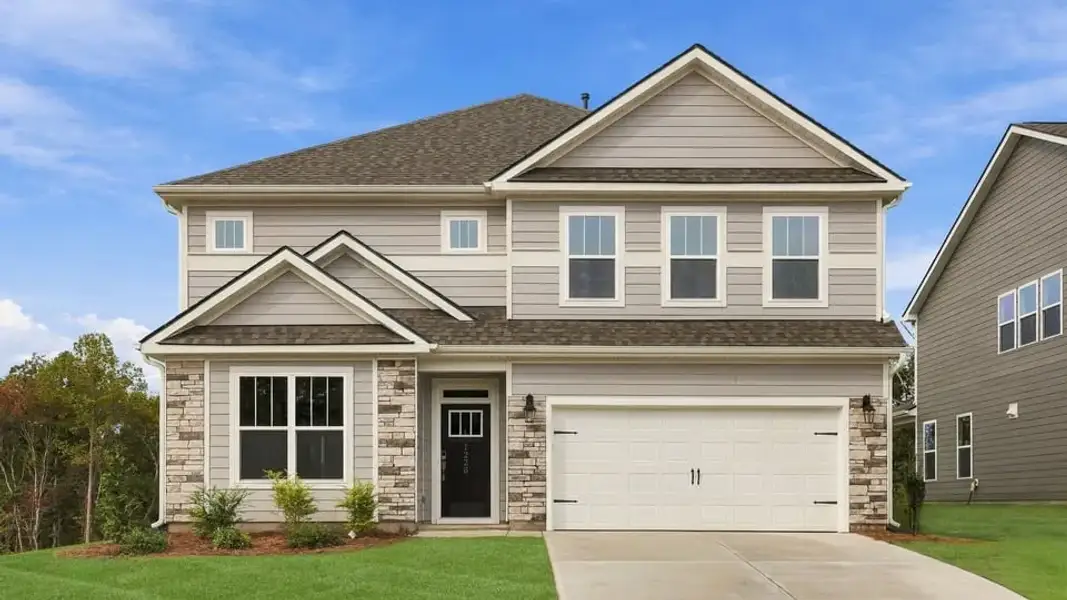 Front exterior of a new home in Spring Ridge Reserve, Anderson, SC, highlighting curb appeal (Image 1). Front exterior of a new home in Spring Ridge Reserve, Anderson, SC, highlighting curb appeal (Image 1).