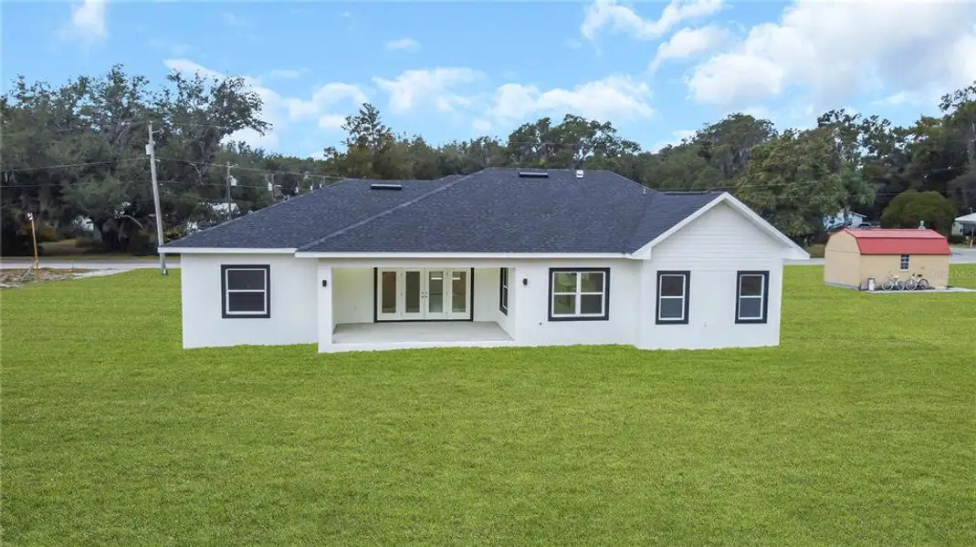 Exterior details and patio area of a home in , Zephyrhills (Image 14).