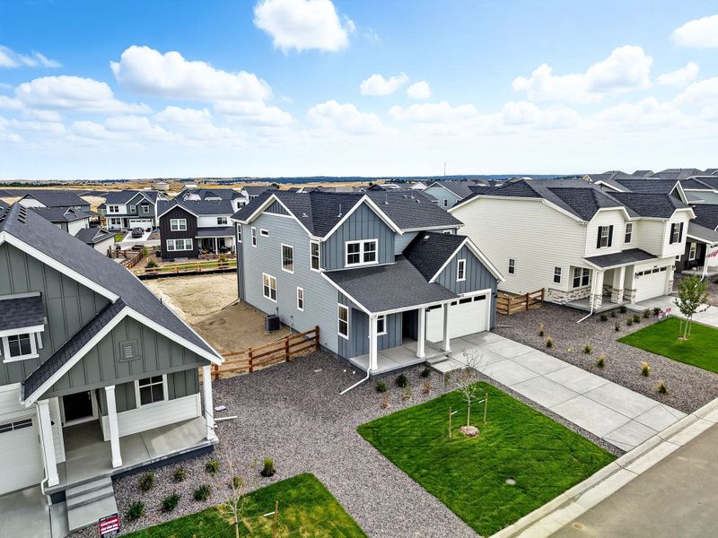 Front exterior of a new home in The Town Collection at Independence, Elizabeth, CO, highlighting curb appeal (Image 2).