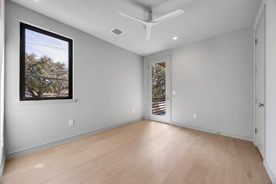 Bedroom 2 has a walk-out to a covered balcony that faces east.