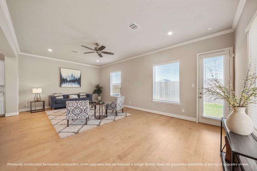 Walls of windows flood the room with natural light, blurring the line between indoors and out.