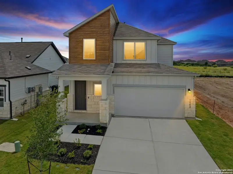 Front exterior of a new home in Willowbrook, New Braunfels, TX, highlighting curb appeal (Image 1).