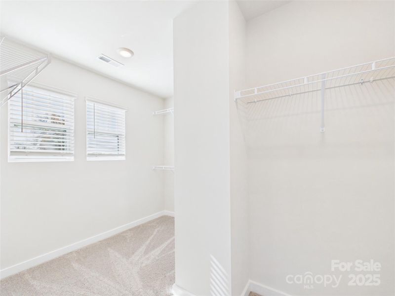 Primary suite walk-in closet.