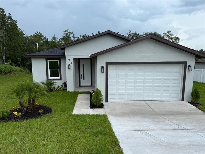 Front exterior of a new home in , Spring Hill, FL, highlighting curb appeal (Image 25). Front exterior of a new home in , Spring Hill, FL, highlighting curb appeal (Image 25).