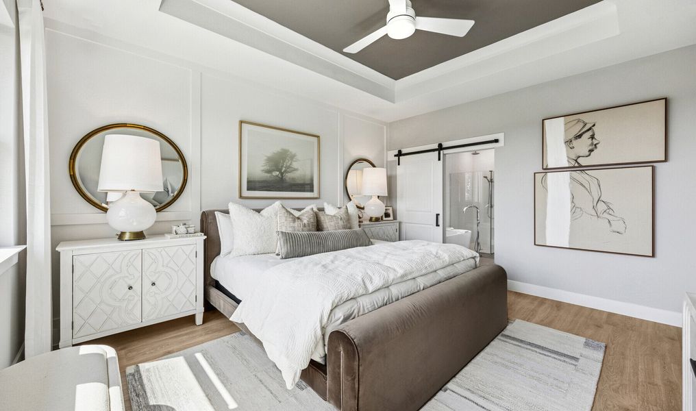 Primary suite with decorated feature wall & tray ceiling
