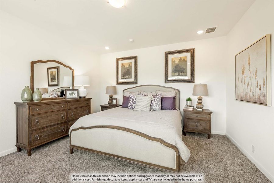 Bedroom with upholstered bed, wood dresser with mirror, nightstands, and neutral carpet
