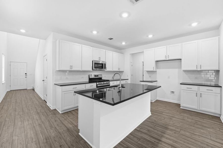 Furnished interior view inside a new home in Longview 40s, Del Valle (Image 6).