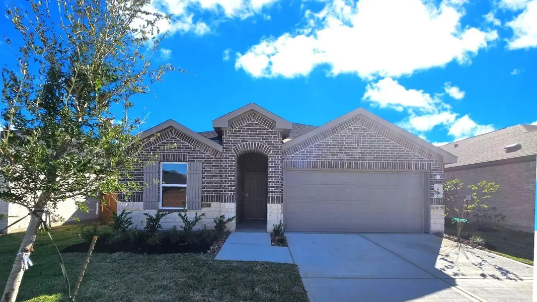 Front exterior of a new home in Cypress Green, Hockley, TX, highlighting curb appeal (Image 2).