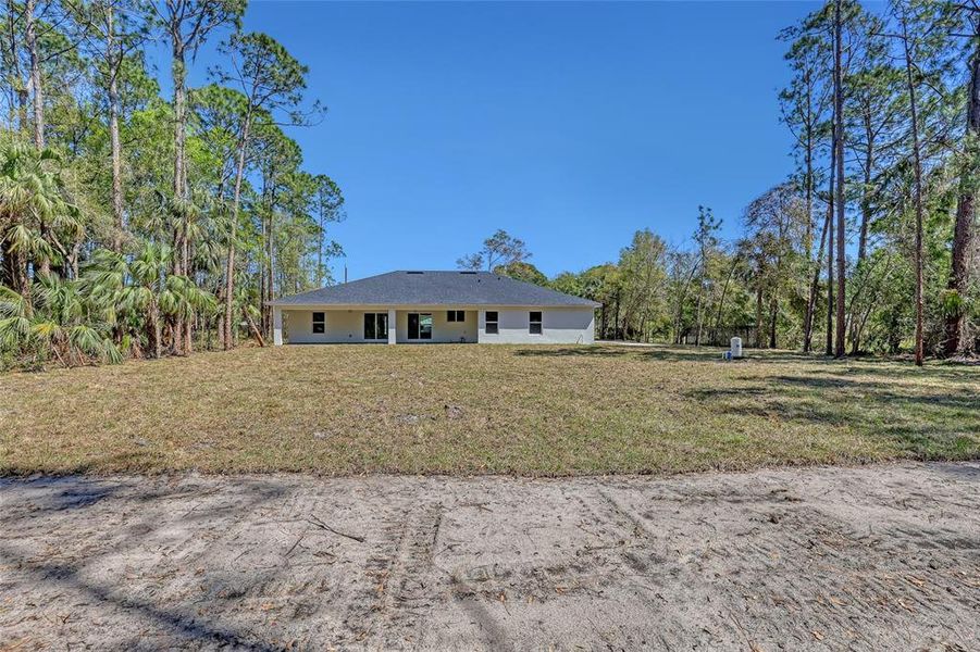 Front exterior of a new home in , Mims, FL, highlighting curb appeal (Image 22).