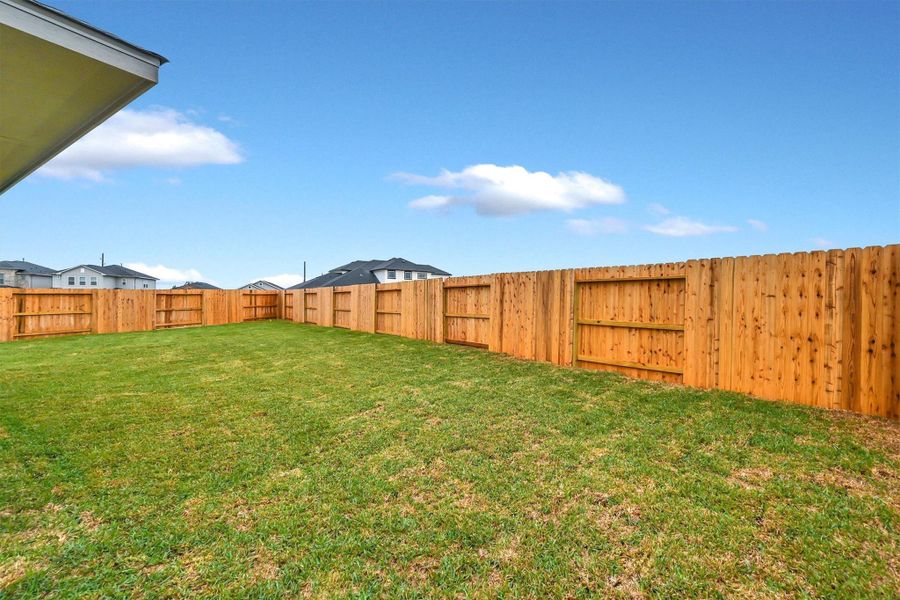 Exterior details and patio area of a home in La Segarra 40', Brookshire (Image 26).