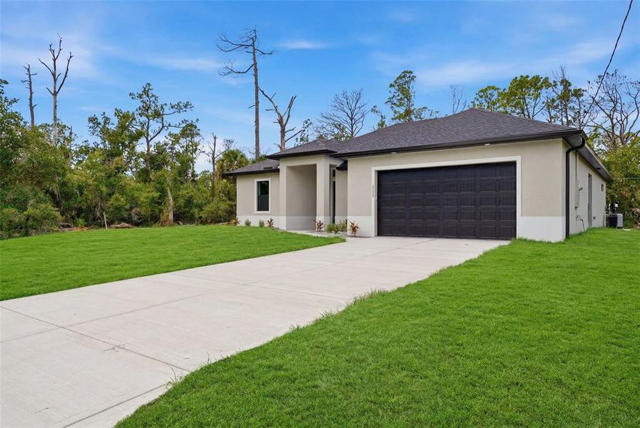 Front exterior of a new home in , Port Charlotte, FL, highlighting curb appeal (Image 23).