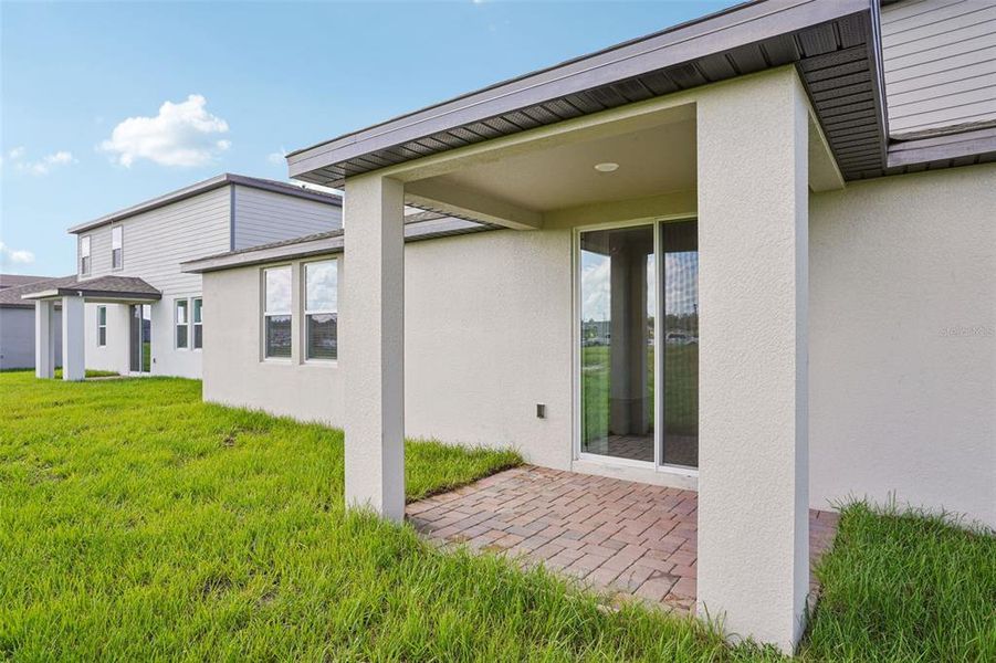Exterior details and patio area of a home in The Meadow at Crossprairie, St. Cloud (Image 21).