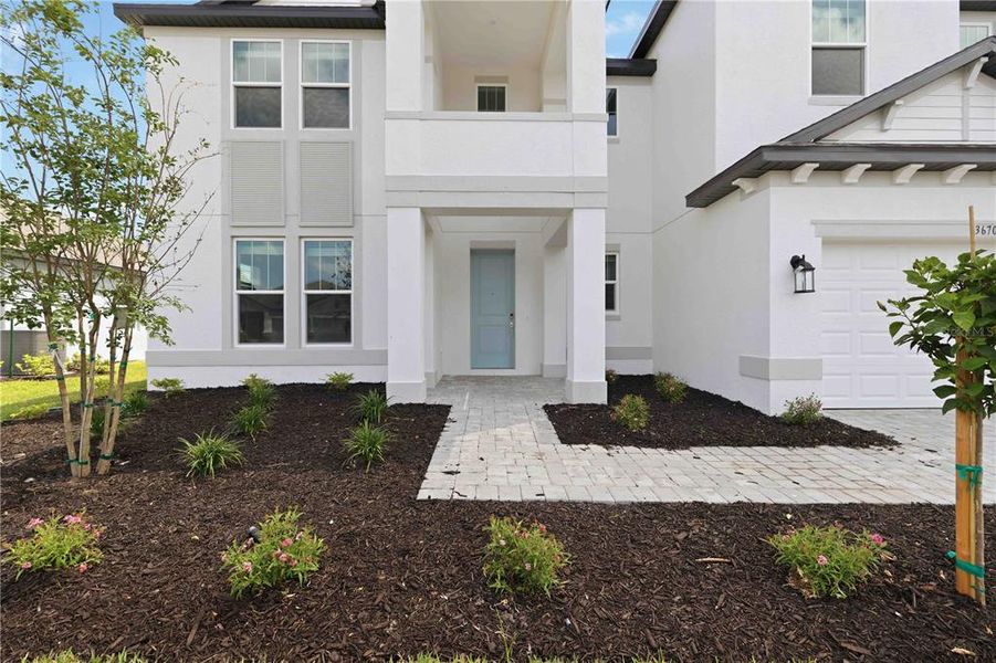 Exterior details and patio area of a home in Creeks Edge at Twin Rivers, Parrish (Image 30).