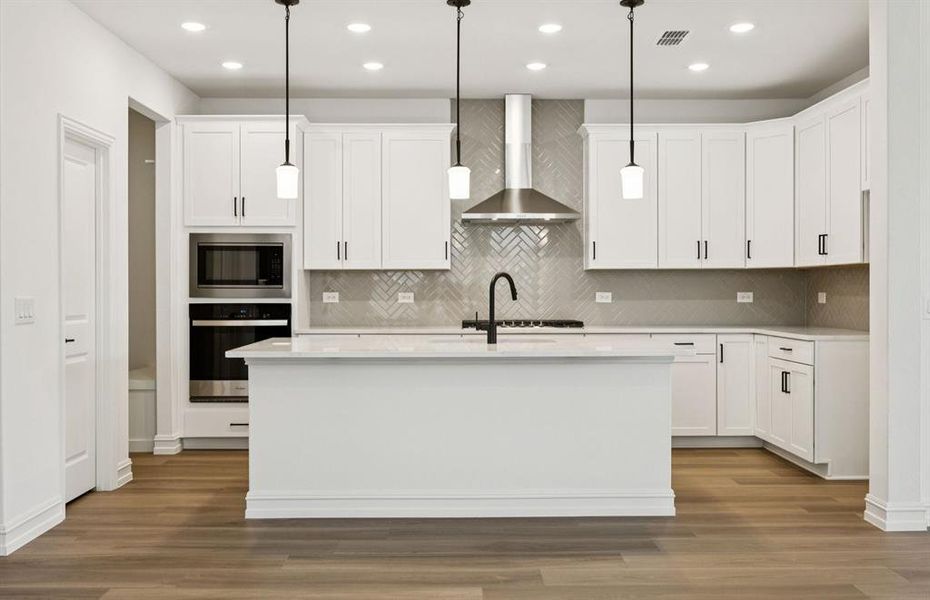 Spacious kitchen with oversized island *real home pictured