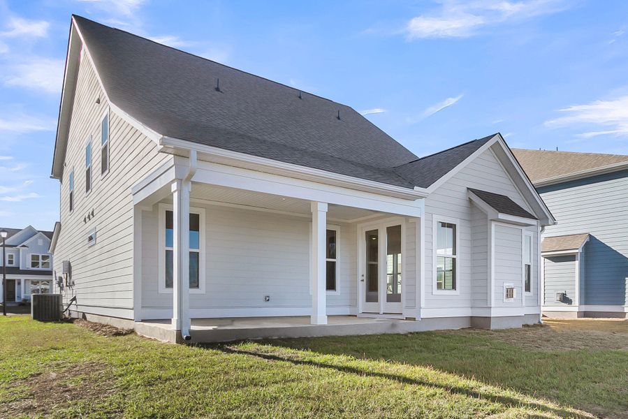 Exterior details and patio area of a home in Tidewater at Lakes of Cane Bay, Summerville (Image 3).