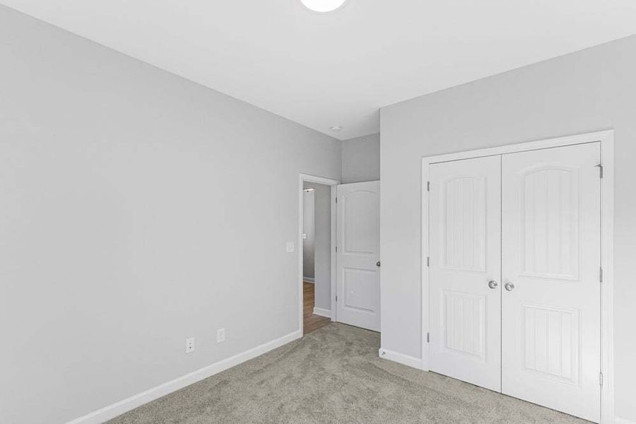 Representative unfurnished interior of a home built from the Weymouth by Caviness & Cates Communities in Bartlett Manor, Youngsville (Image 45).