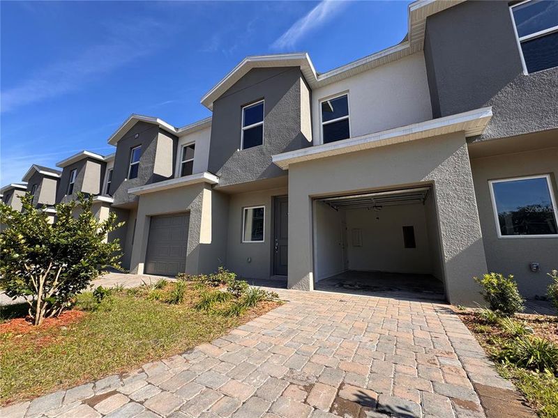 Front exterior of a new home in , Orlando, FL, highlighting curb appeal (Image 1). Front exterior of a new home in , Orlando, FL, highlighting curb appeal (Image 1).