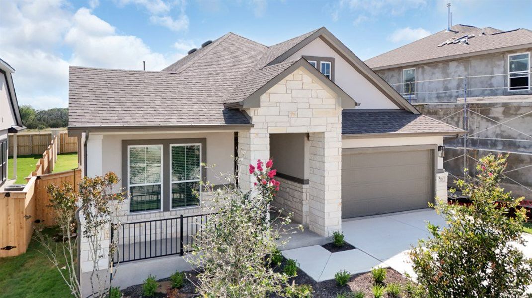 Front exterior of a new home in Parkside on the River, Georgetown, TX, highlighting curb appeal (Image 27). Front exterior of a new home in Parkside on the River, Georgetown, TX, highlighting curb appeal (Image 27).