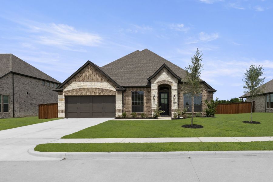 Front exterior of a new home in Lovers Landing, Forney, TX, highlighting curb appeal (Image 1). Front exterior of a new home in Lovers Landing, Forney, TX, highlighting curb appeal (Image 1).