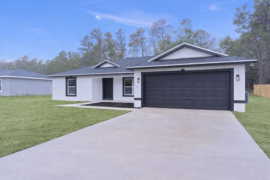 Front exterior of a new home in , Ocklawaha, FL, highlighting curb appeal (Image 19).