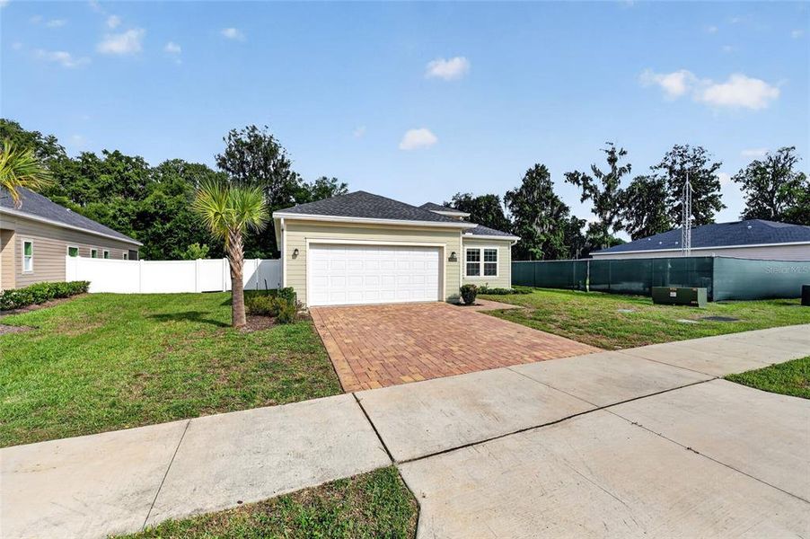 Front exterior of a new home in Heath Preserve, Ocala, FL, highlighting curb appeal (Image 23).