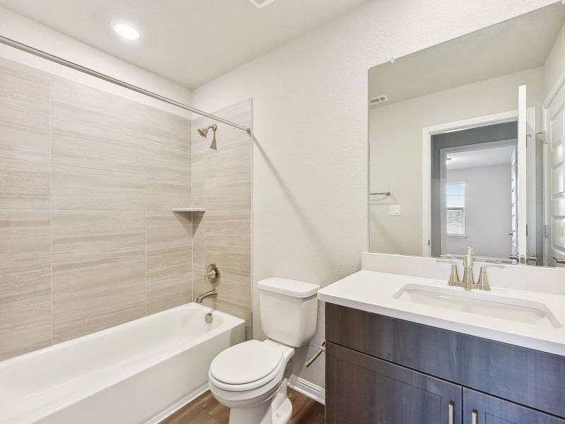 Furnished interior view inside a new home in Big Sky Ranch - Executive Collection, Dripping Springs (Image 8).