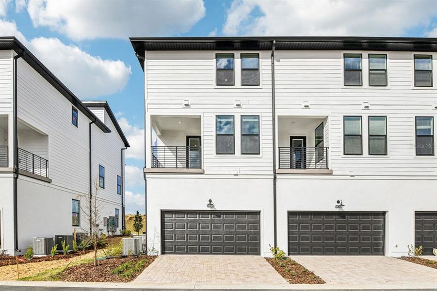 Front exterior of a new home in Parkview at Hamlin, Winter Garden, FL, highlighting curb appeal (Image 25).
