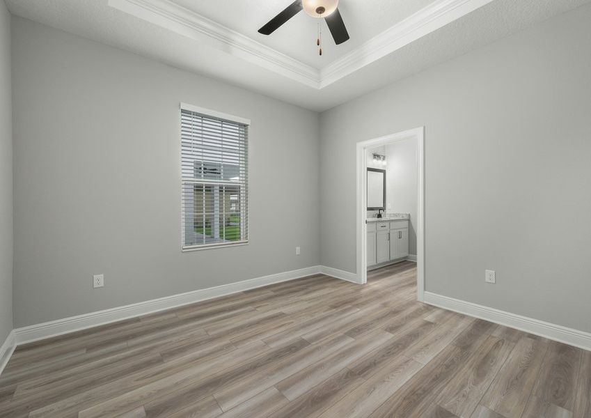 Master bedroom with a ceiling fan