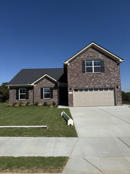 Front exterior of a new home in Bradley Bend, Ashland City, TN, highlighting curb appeal (Image 1).