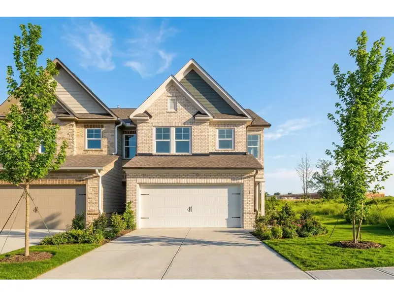 Front exterior of a new home in Lake Shore, Winder, GA, highlighting curb appeal (Image 1). Front exterior of a new home in Lake Shore, Winder, GA, highlighting curb appeal (Image 1).