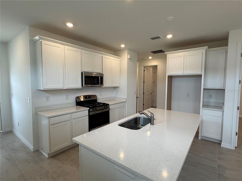 Furnished interior view inside a new home in Fairway Pointe - 55+ Villa Community, Sun City Center (Image 3).