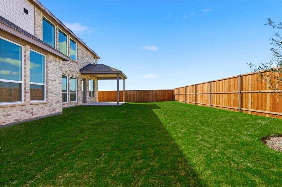 Fenced backyard with a patio Fenced backyard with a patio