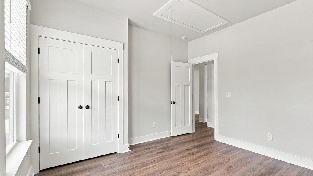 Functional secondary bedrooms with hardwood flooring and modern touches in an exceptional layout Functional secondary bedrooms with hardwood flooring and modern touches in an exceptional layout