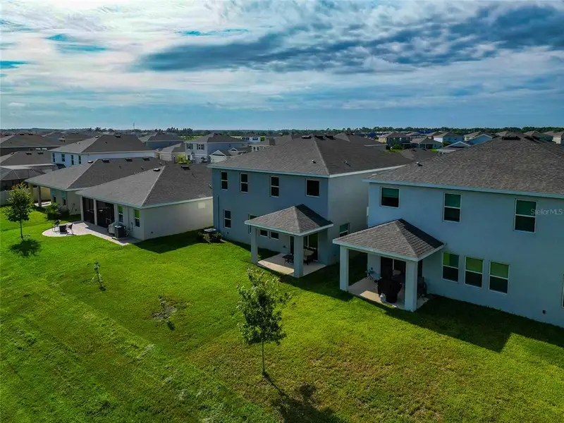 Front exterior of a new home in , Apollo Beach, FL, highlighting curb appeal (Image 19).