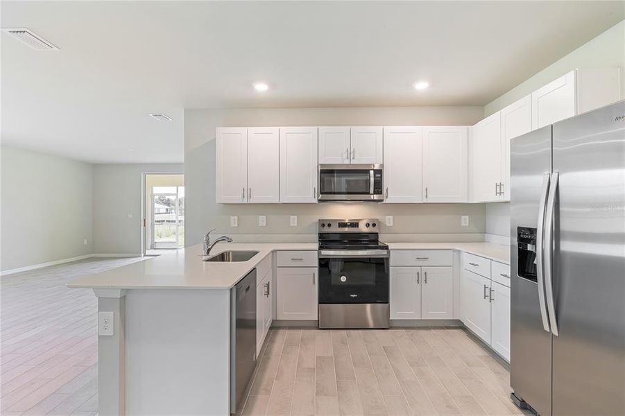 Furnished interior view inside a new home in Heritage Lake Park, Punta Gorda (Image 7).