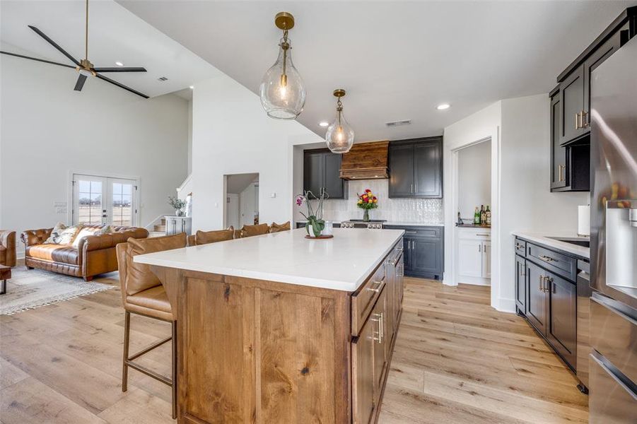 The open kitchen/dining/living area flows seamlessly for comfort and entertaining.