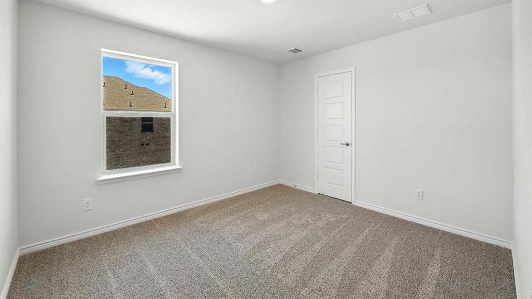 Spare room with carpet floors and baseboards