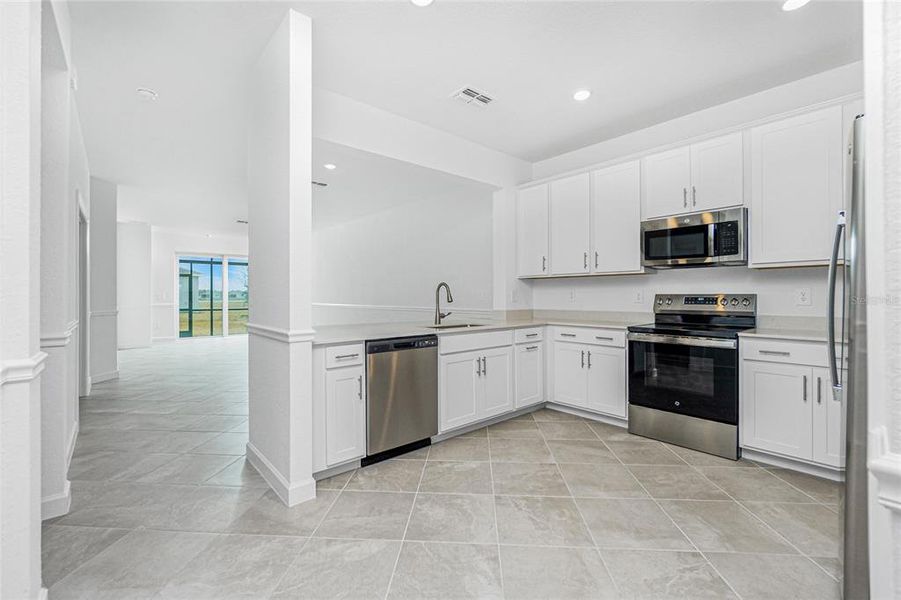 Furnished interior view inside a new home in Island Lakes at Coco Bay: Villas, Englewood (Image 5).