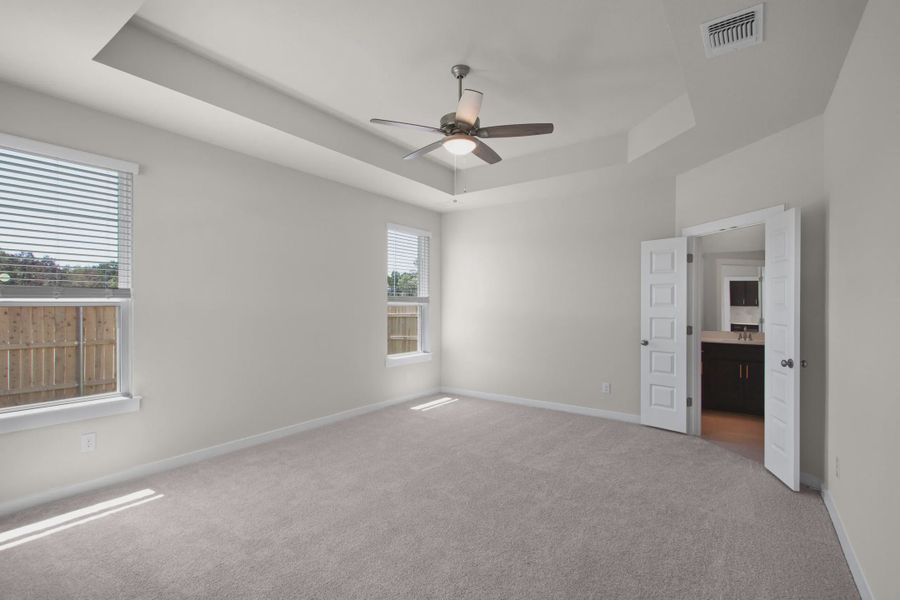 Representative unfurnished interior of a home built from the Warner by Chesmar Homes in The Grove at Blackhawk, Pflugerville (Image 7).