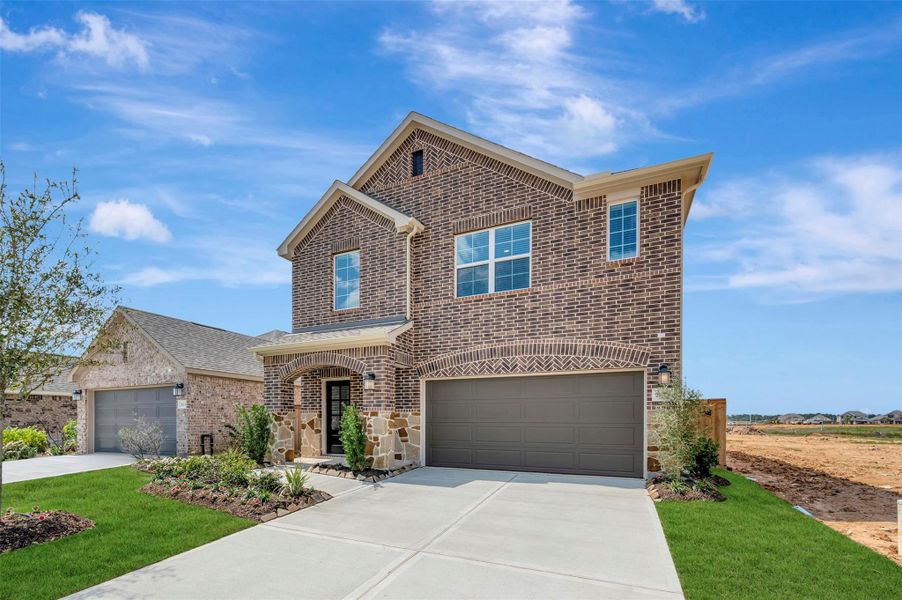 Front exterior of a new home in Sorella, Tomball, TX, highlighting curb appeal (Image 17).