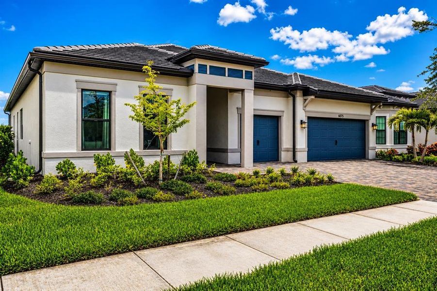 Front exterior of a new home in , Nokomis, FL, highlighting curb appeal (Image 2). Front exterior of a new home in , Nokomis, FL, highlighting curb appeal (Image 2).