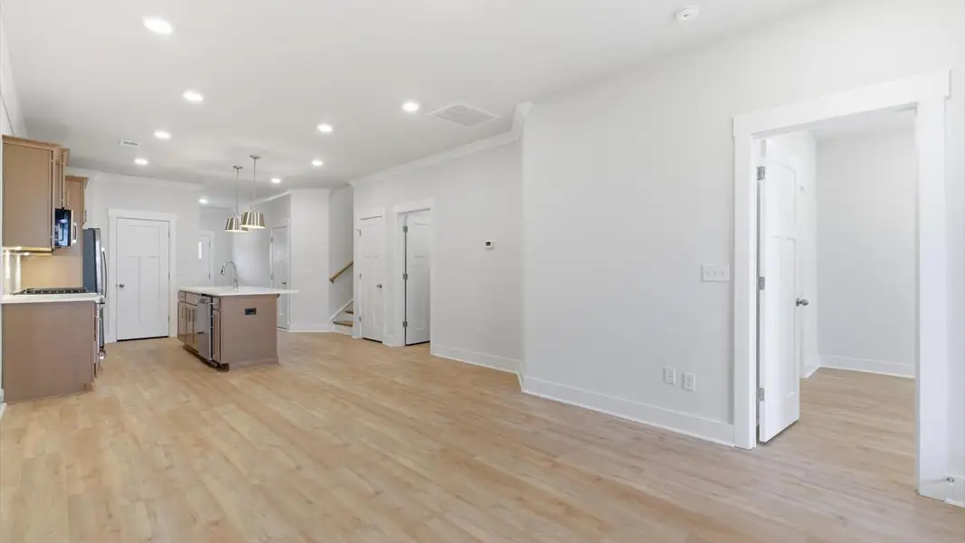 Hardwood flooring and high standards define this vibrant family room ideal for everyday living in Greenville, SC