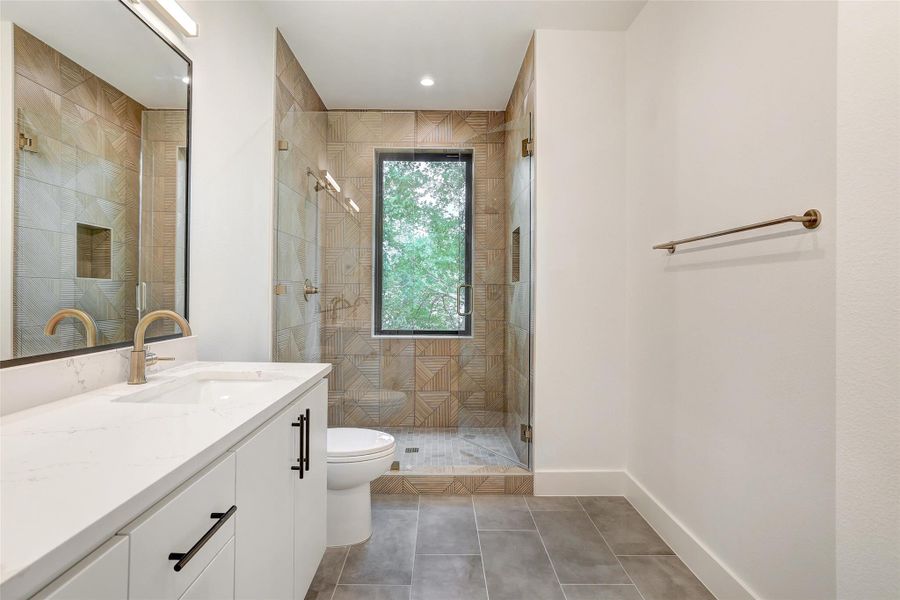 Full bath with vanity, a shower stall, tile patterned floors, and recessed lighting Full bath with vanity, a shower stall, tile patterned floors, and recessed lighting