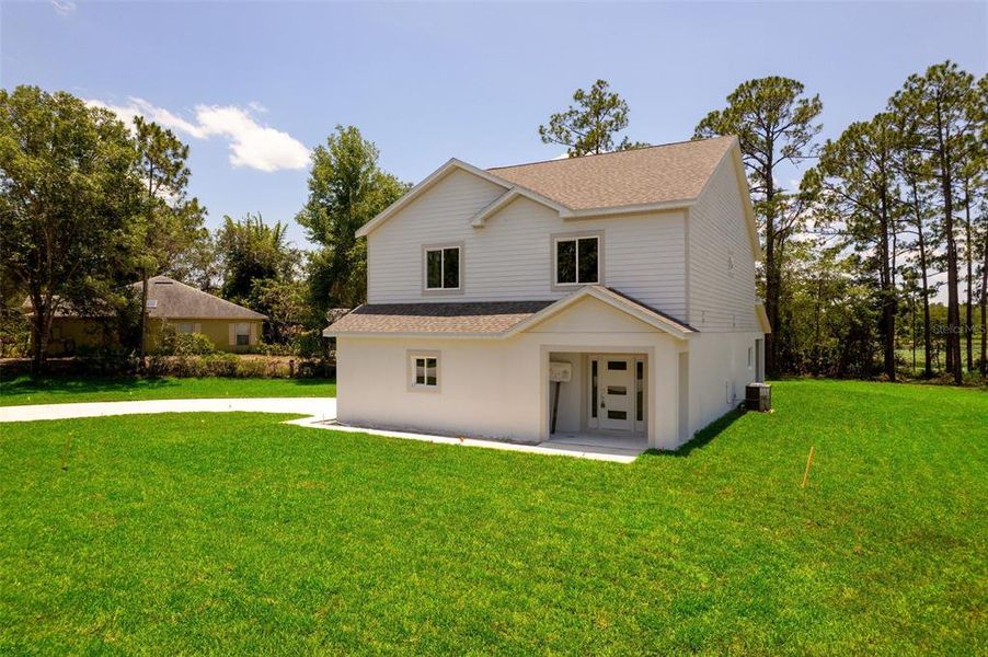Front exterior of a new home in , Deltona, FL, highlighting curb appeal (Image 29).