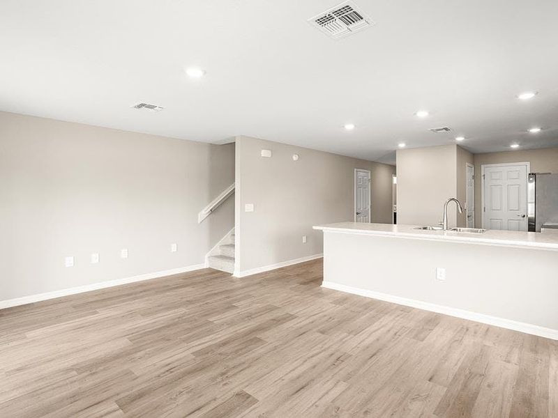 This 2-story, end-unit townhome features a sunny, open living area - Bimini townhome by Highland Homes
