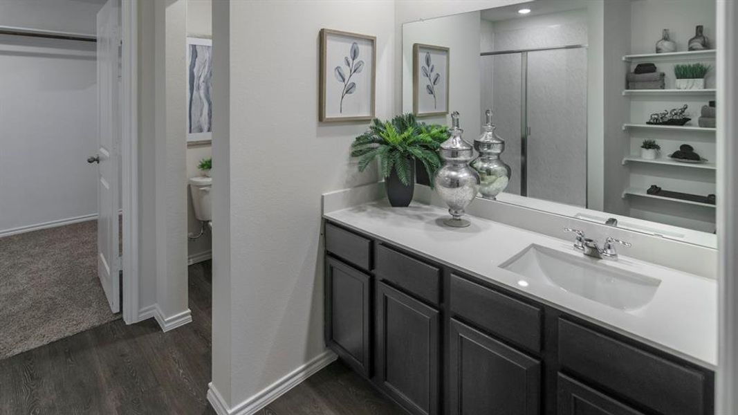 Bathroom vanity featuring a single integrated sink, chrome faucet, and quartz countertop Bathroom vanity featuring a single integrated sink, chrome faucet, and quartz countertop